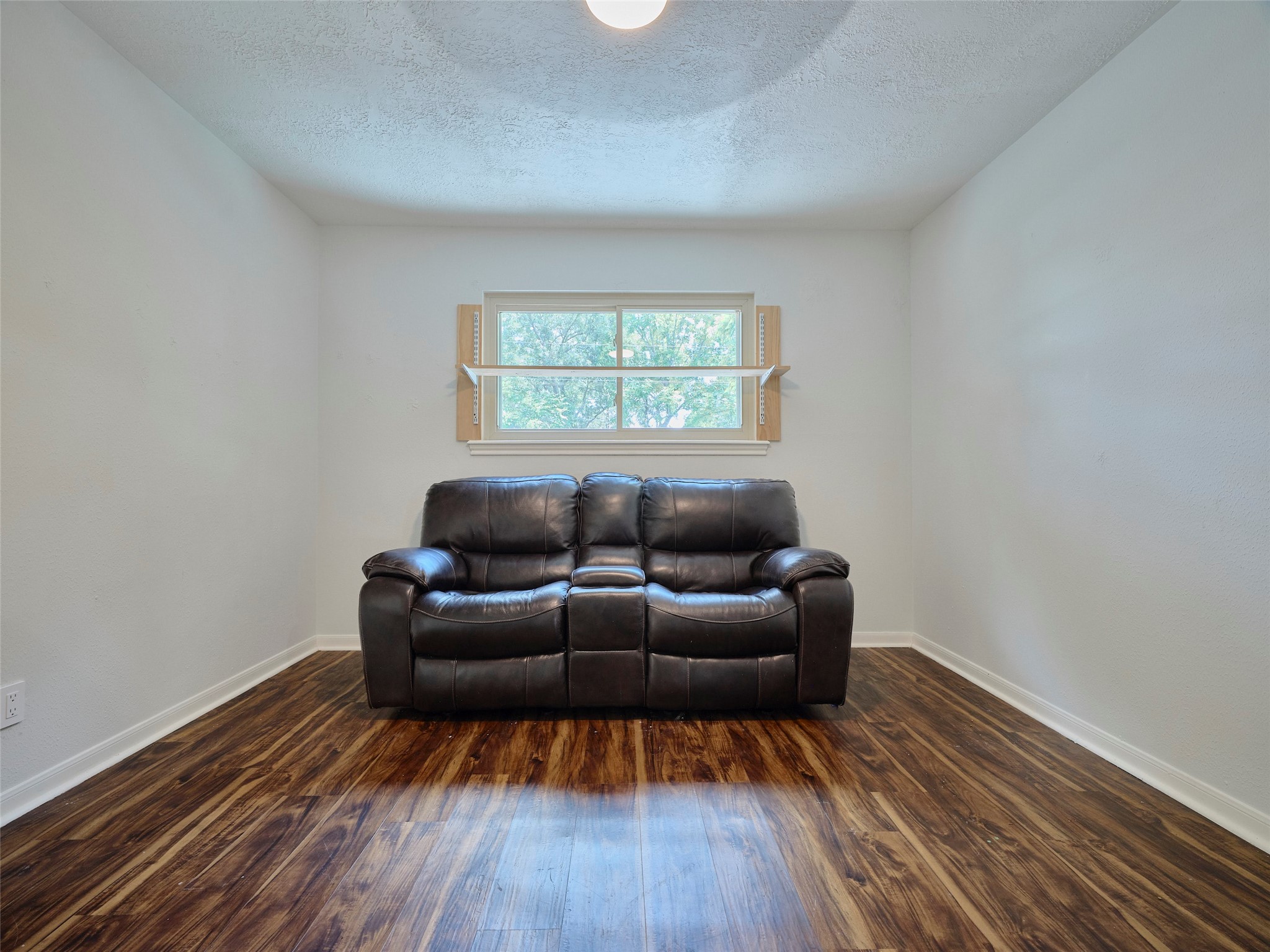 6915 Worcester Drive Spring, TX 77379 - Photo 31 of 38 a living room with furniture and a wooden floor