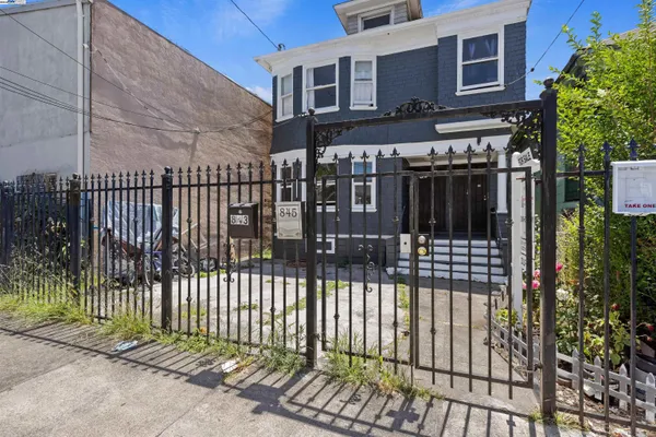 a view of a brick house with a street view