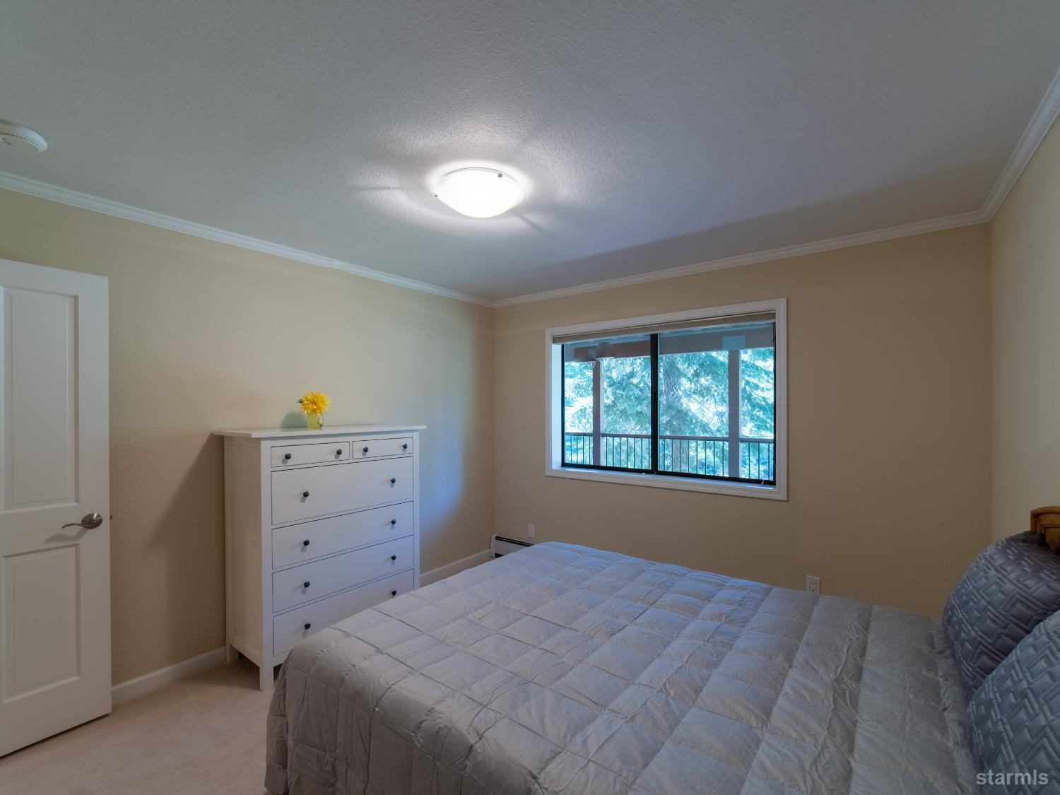 214 Uplands Way South Lake Tahoe, CA 96150 - Photo 11 of 27 a bedroom with a bed and window