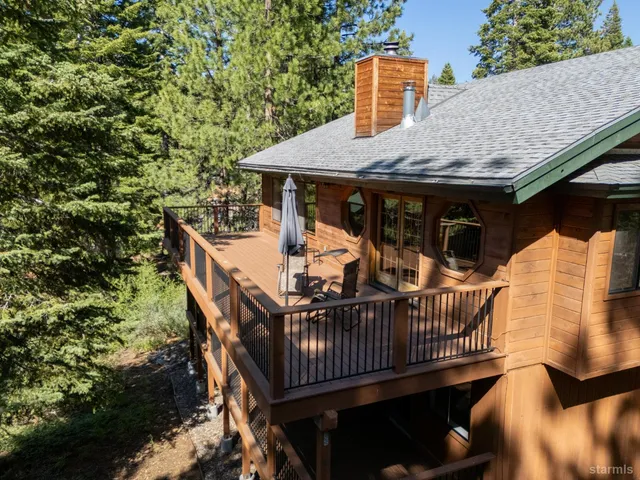 a view of balcony with deck and furniture