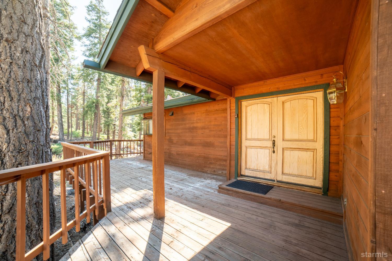 214 Uplands Way South Lake Tahoe, CA 96150 - Photo 27 of 27 a view of a porch with wooden floor and outdoor space