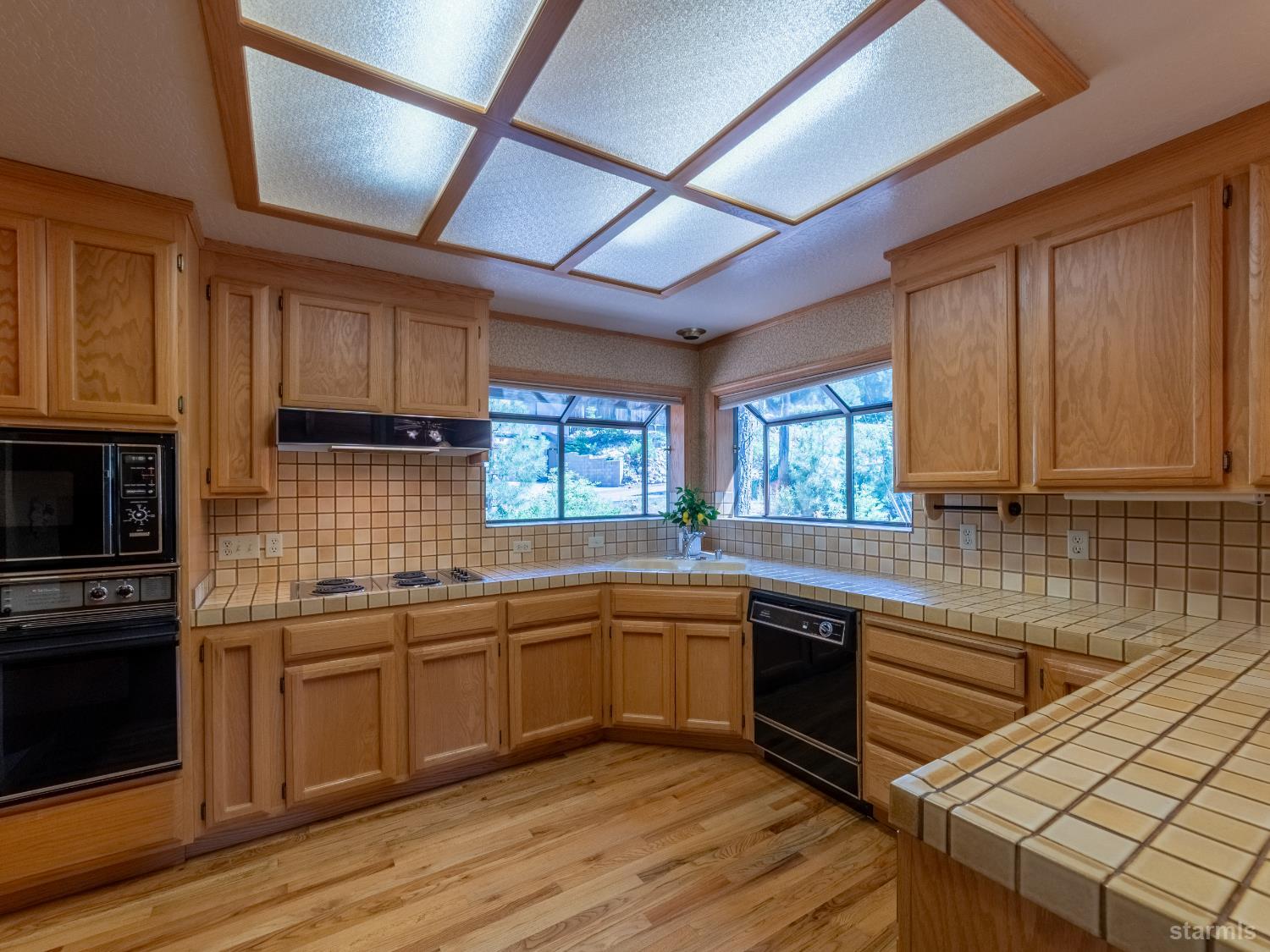 214 Uplands Way South Lake Tahoe, CA 96150 - Photo 5 of 27 a kitchen with lots of counter space and a sink
