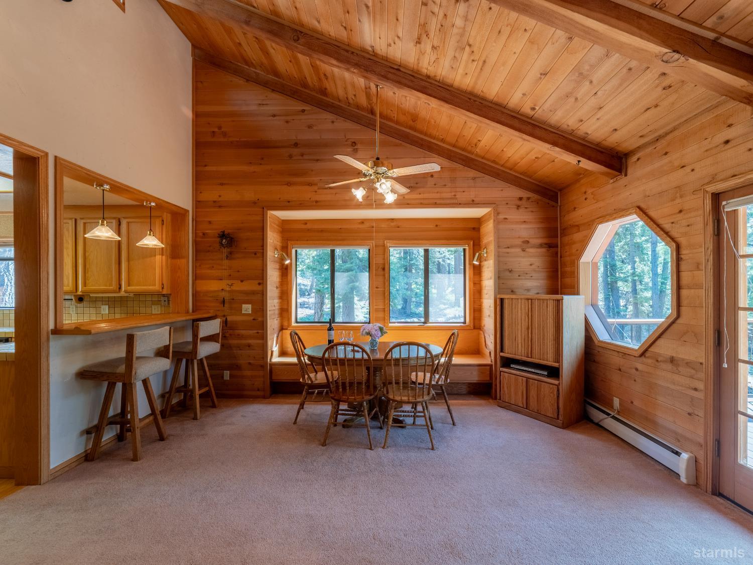 214 Uplands Way South Lake Tahoe, CA 96150 - Photo 6 of 27 a view of a livingroom with furniture and chandelier