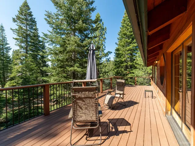 a view of balcony with furniture and wooden floor