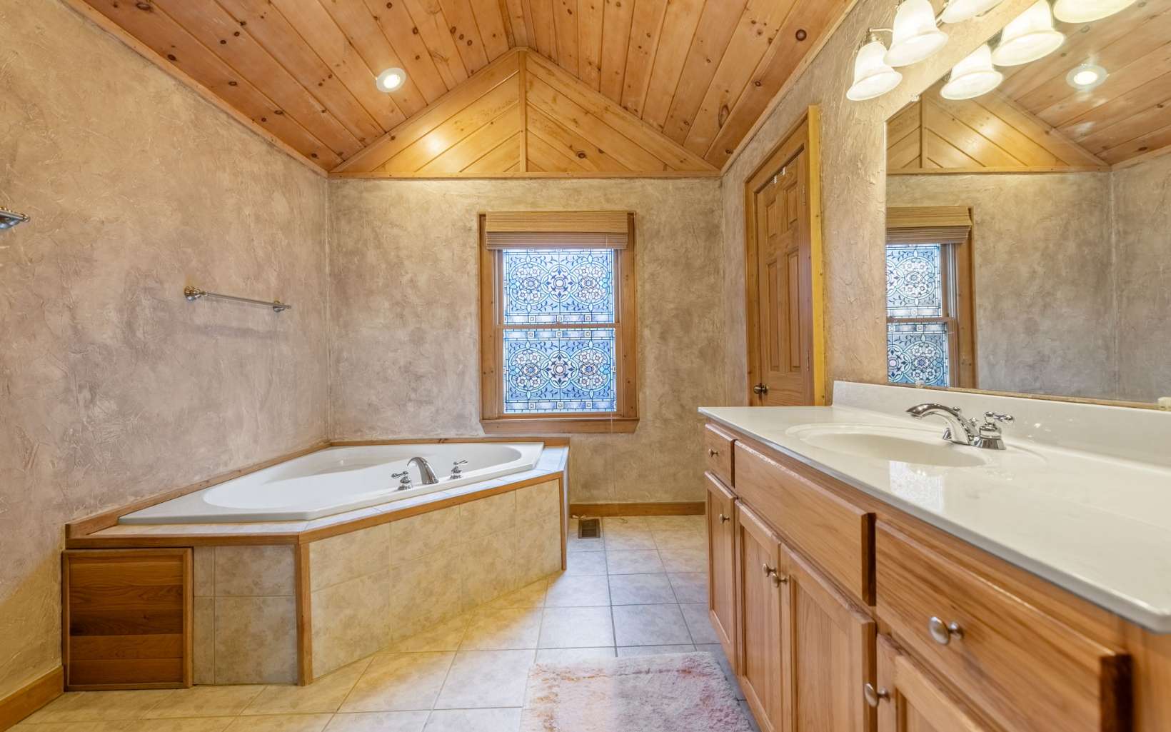 367 Linwood Drive Blue Ridge, GA 30513 - Photo 28 of 56 a spacious bathroom with a tub sink and mirror