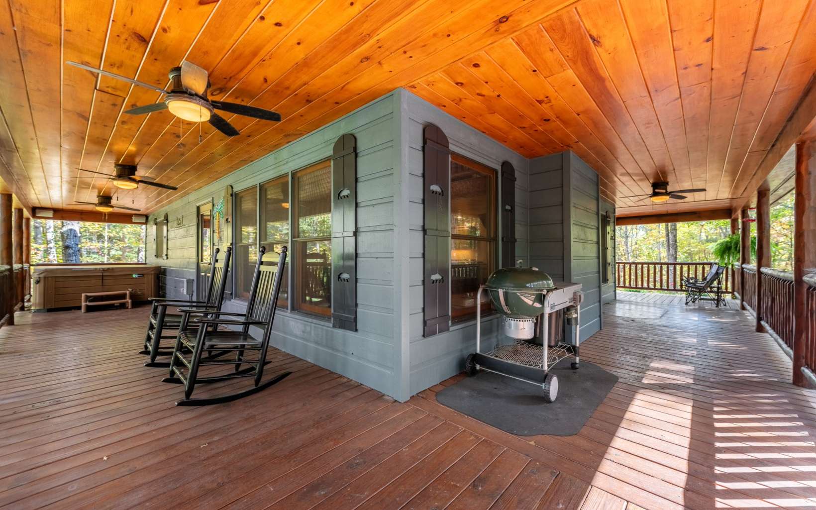 367 Linwood Drive Blue Ridge, GA 30513 - Photo 4 of 56 a view of a patio with table and chairs potted plants with wooden floor and fence