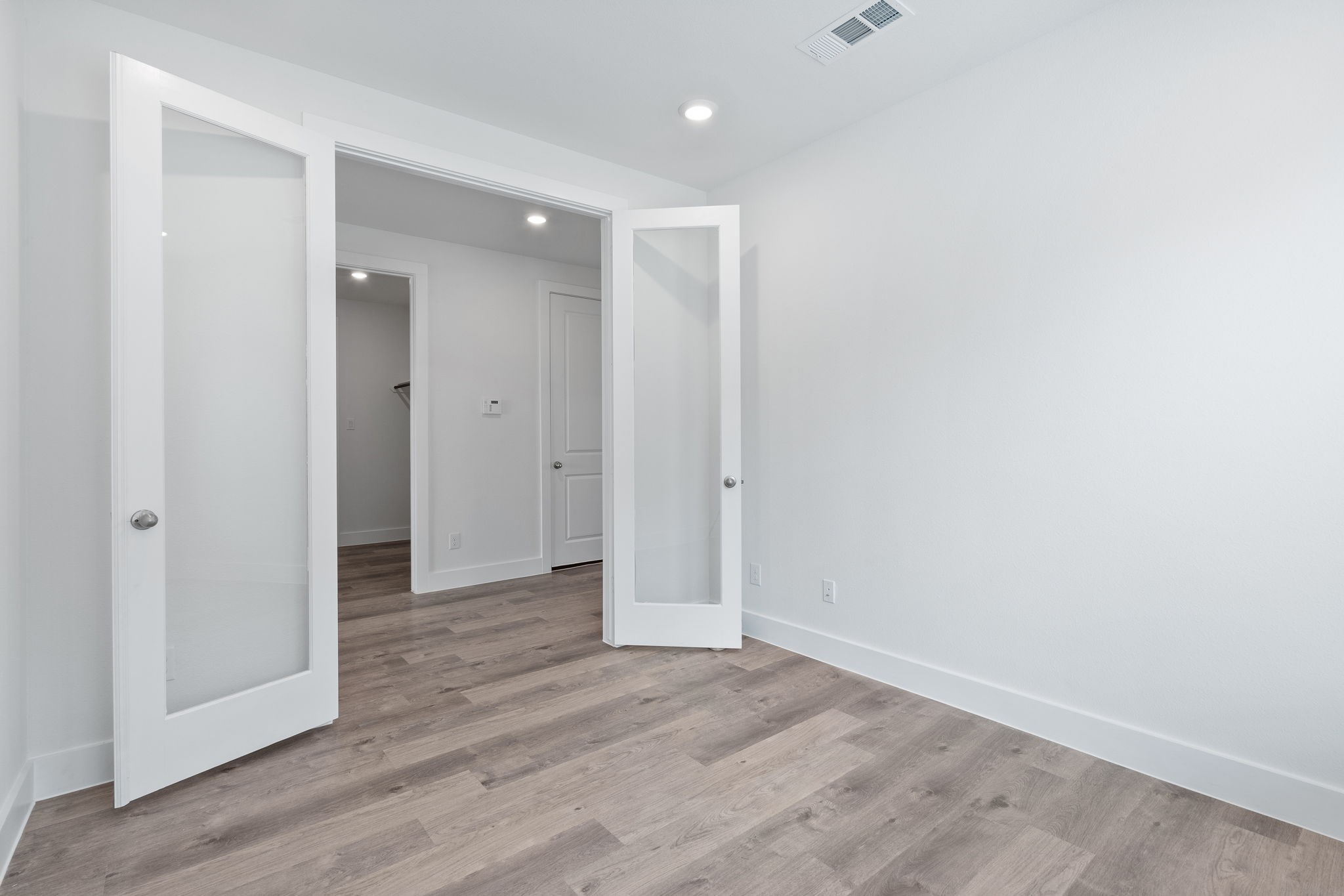 620 Cross Timbers Trace Waller, TX 77484 - Photo 10 of 36 a view of an empty room with wooden floor