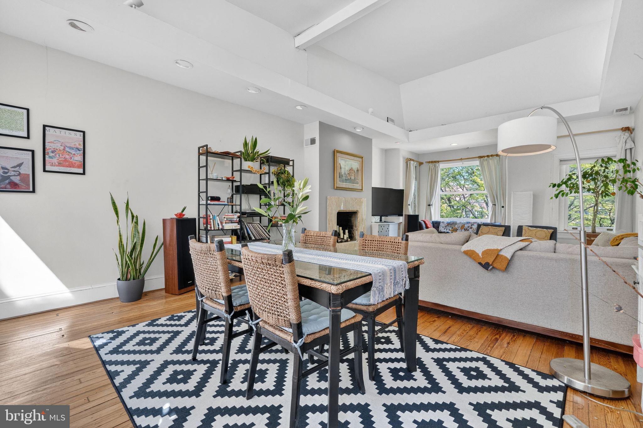 1944 Calvert Street Northwest Washington, DC 20009 - Photo 12 of 85 a view of a dining room with furniture and a rug