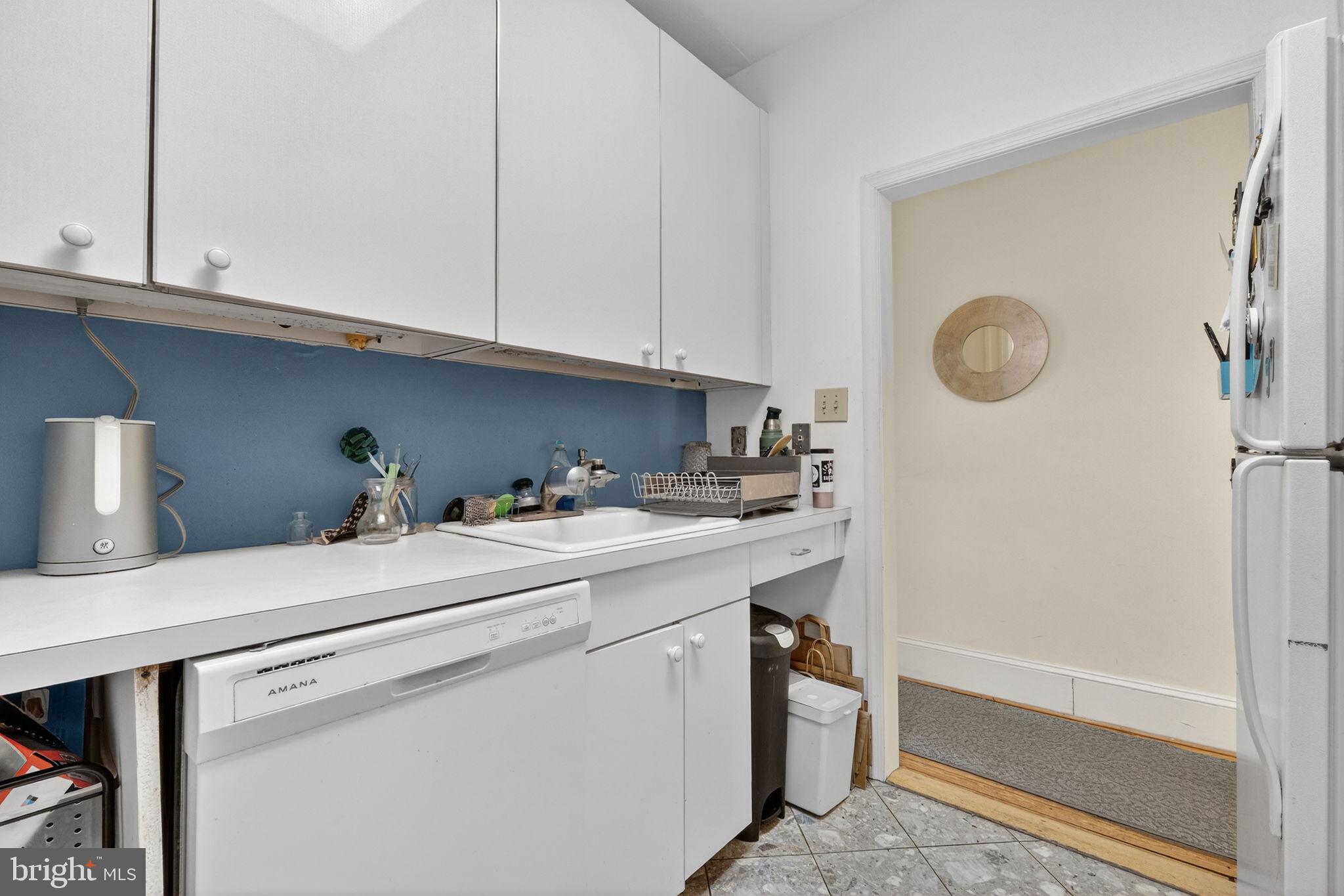 1944 Calvert Street Northwest Washington, DC 20009 - Photo 16 of 85 a utility room with dryer and washer