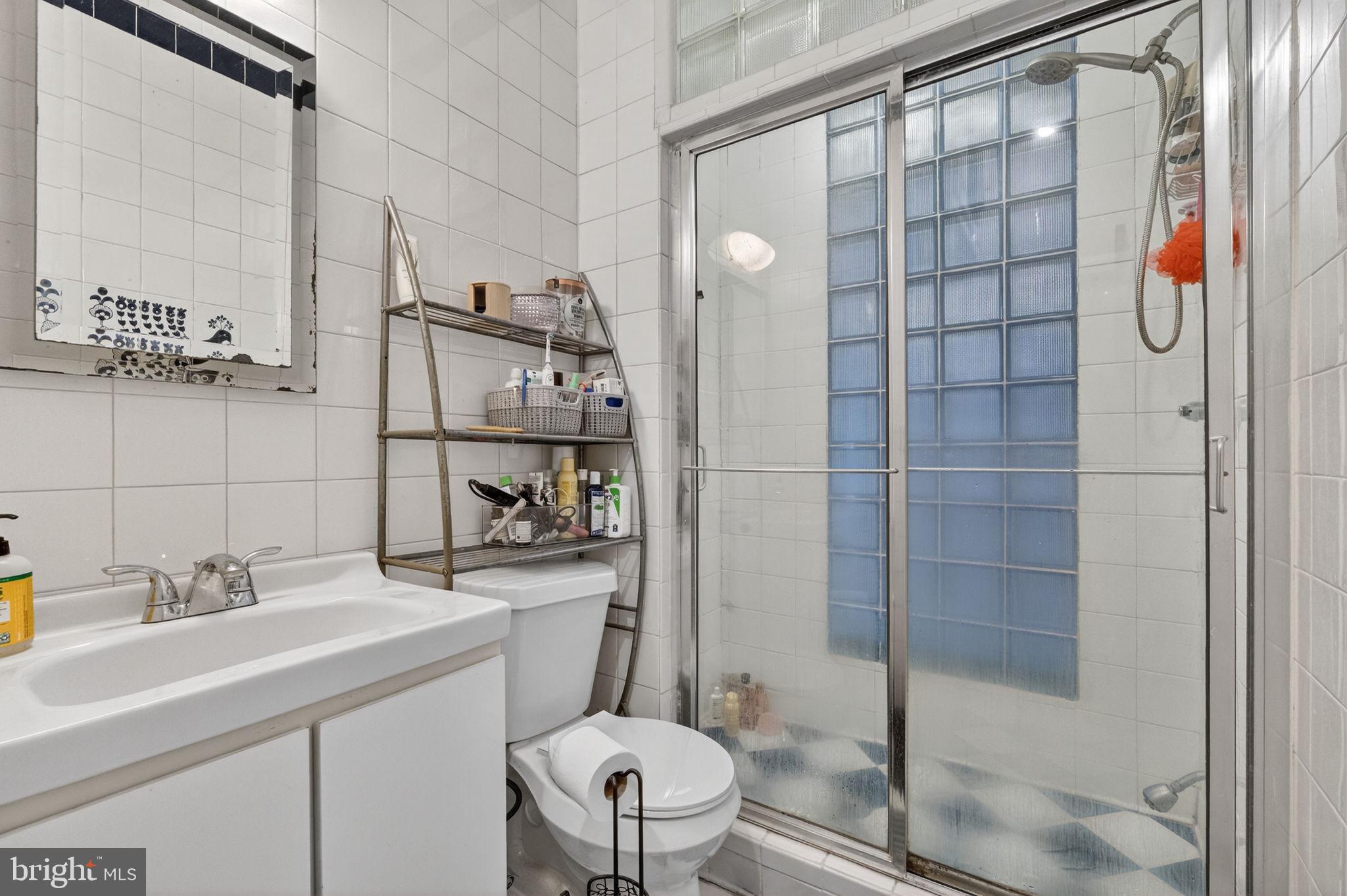1944 Calvert Street Northwest Washington, DC 20009 - Photo 32 of 85 a bathroom with a sink toilet and shower