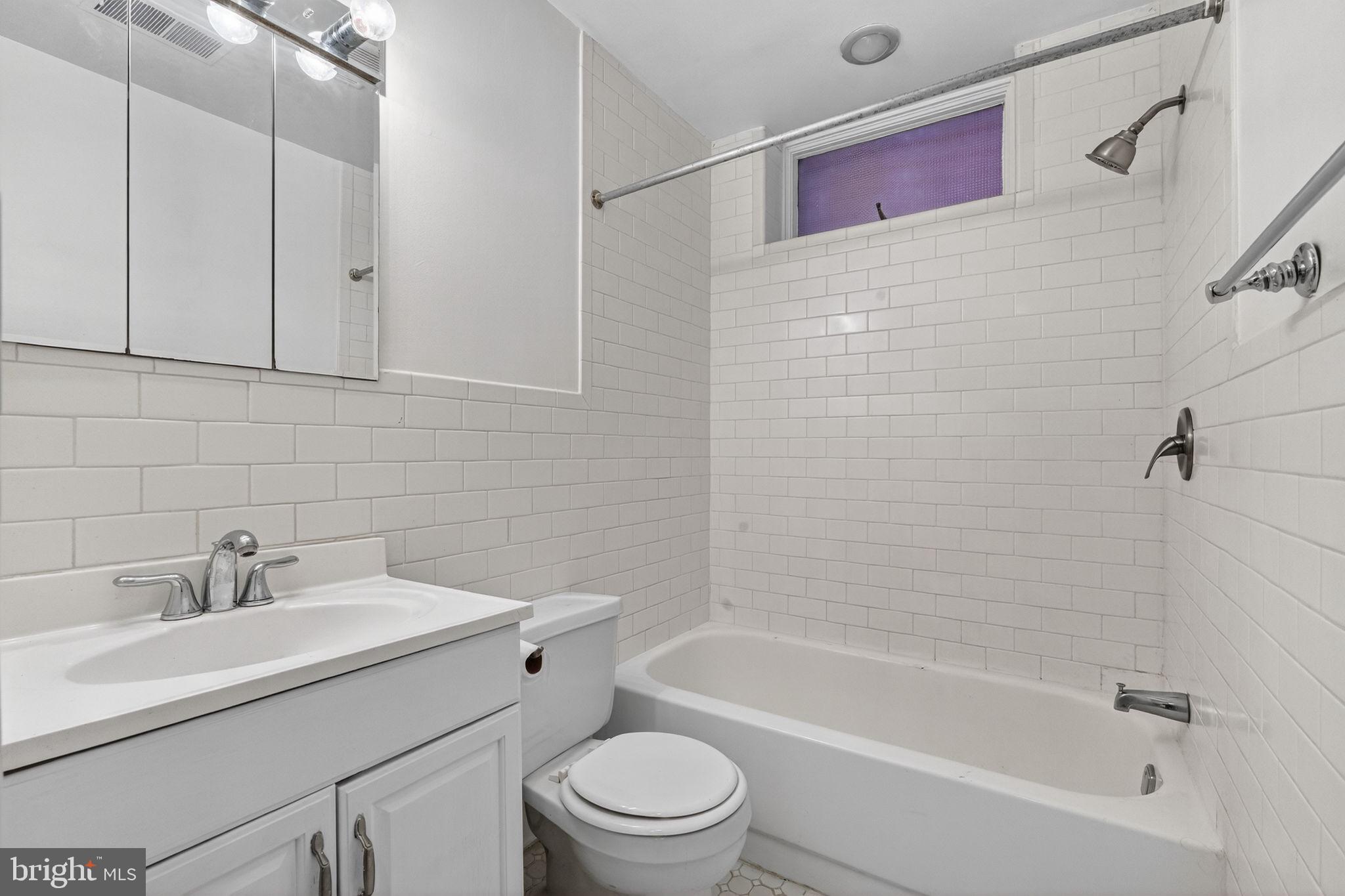 1944 Calvert Street Northwest Washington, DC 20009 - Photo 48 of 85 a bathroom with a sink toilet and shower