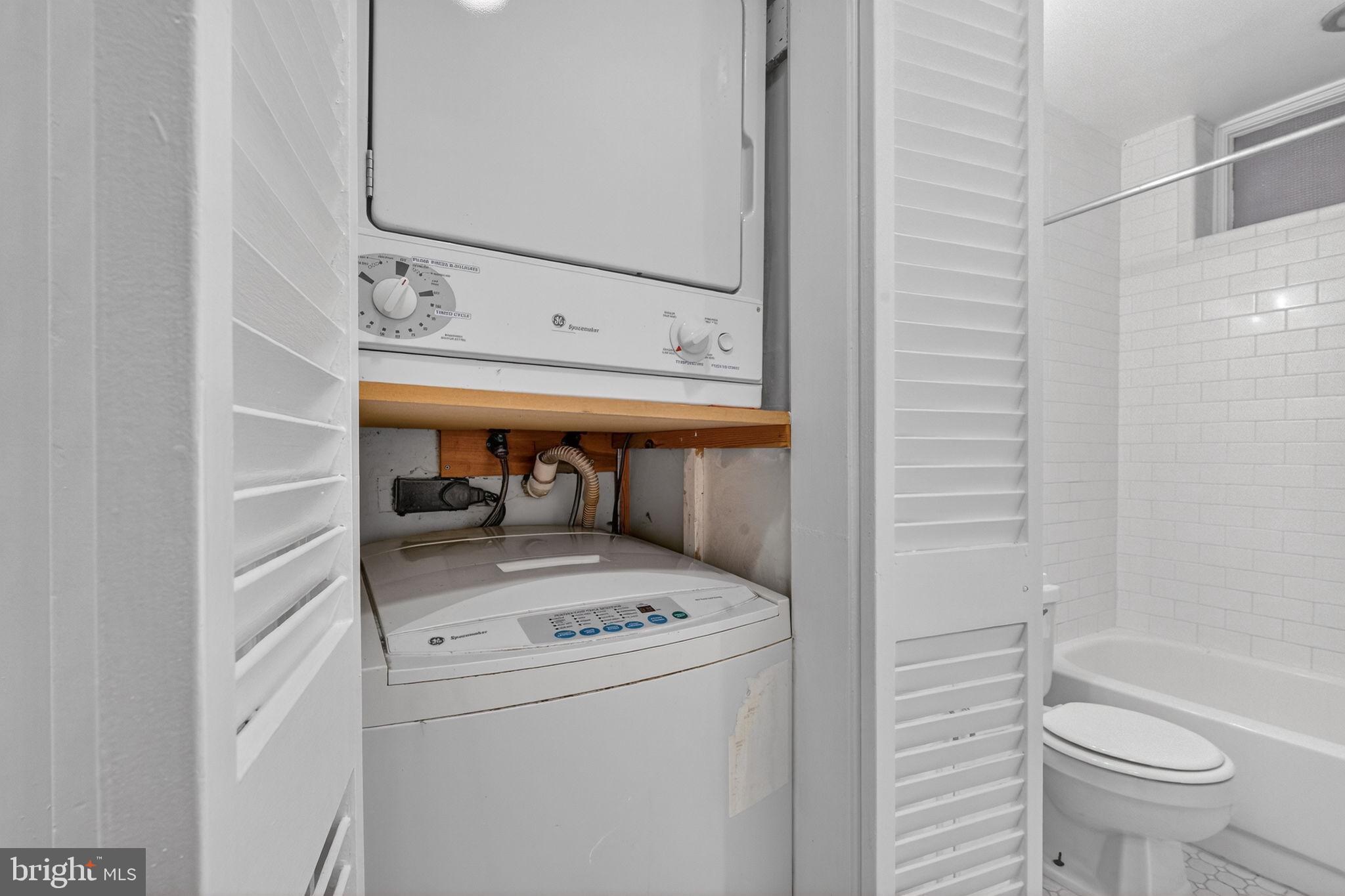 1944 Calvert Street Northwest Washington, DC 20009 - Photo 49 of 85 a utility room with dryer and washer