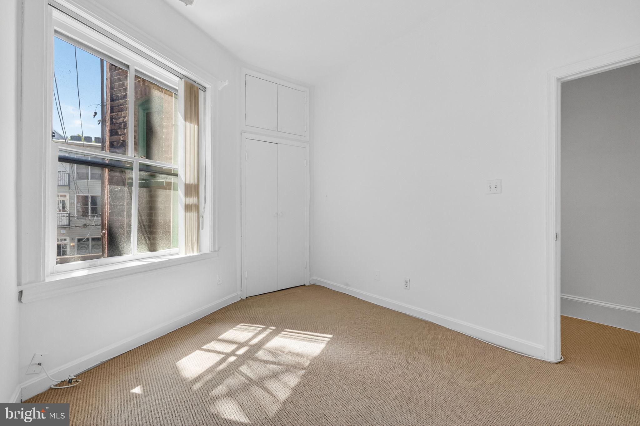 1944 Calvert Street Northwest Washington, DC 20009 - Photo 52 of 85 an empty room with windows