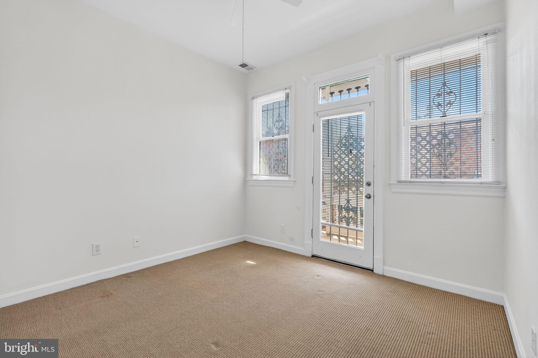 1944 Calvert Street Northwest Washington, DC 20009 - Photo 54 of 85 an empty room with windows