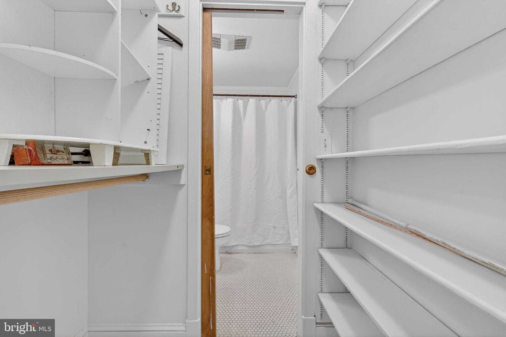 1944 Calvert Street Northwest Washington, DC 20009 - Photo 74 of 85 a view of walk in closet with empty racks