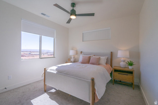 2972 West 570 North Hurricane, UT 84737 - Photo 74 of 104 Carpeted bedroom featuring baseboards and a ceiling fan