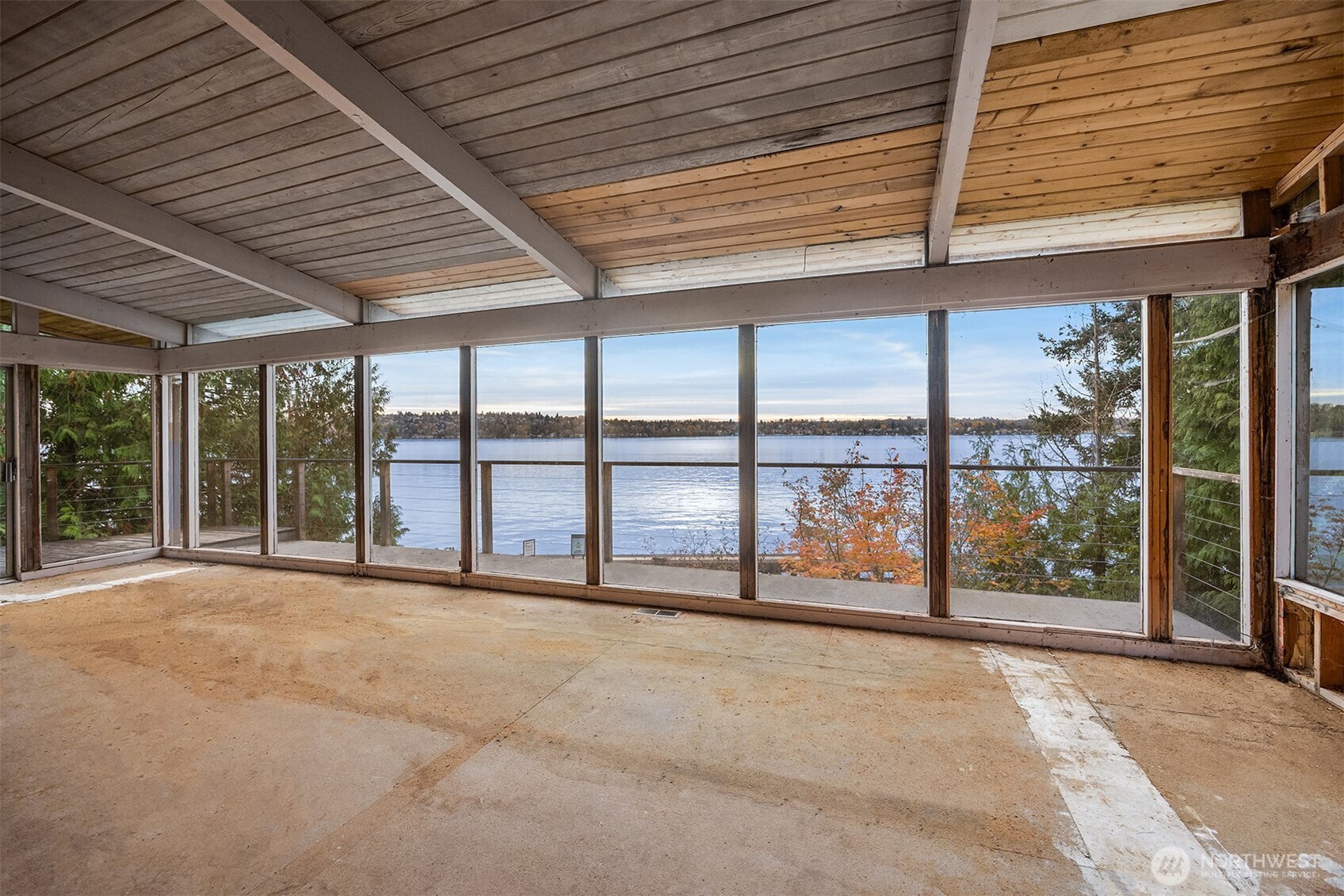 8001 West Mercer Way Mercer Island, WA 98040 - Photo 19 of 20 a view of an empty room with wooden floor and iron stairs