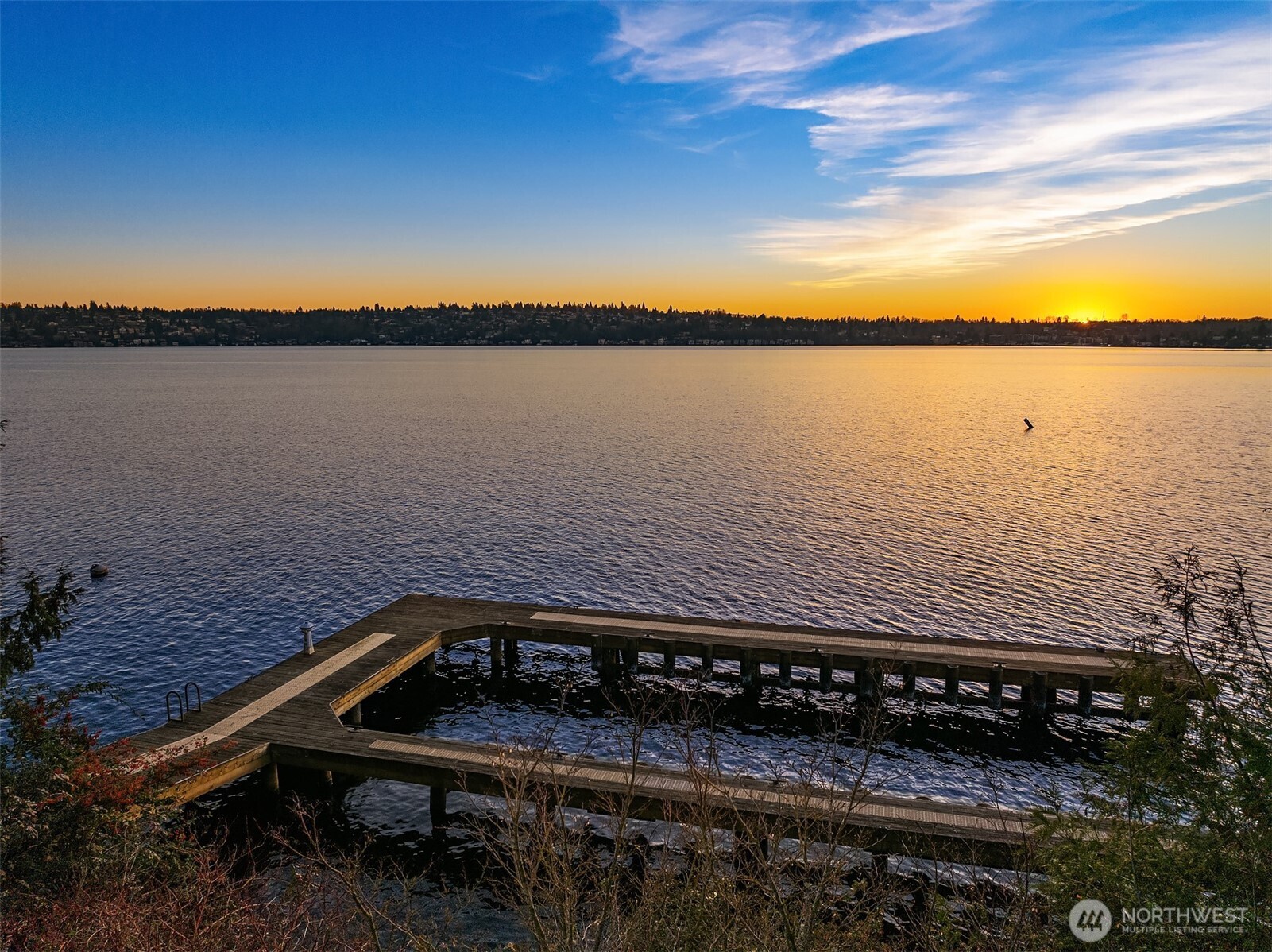 8001 West Mercer Way Mercer Island, WA 98040 - Photo 10 of 20 a view of a lake and sunset