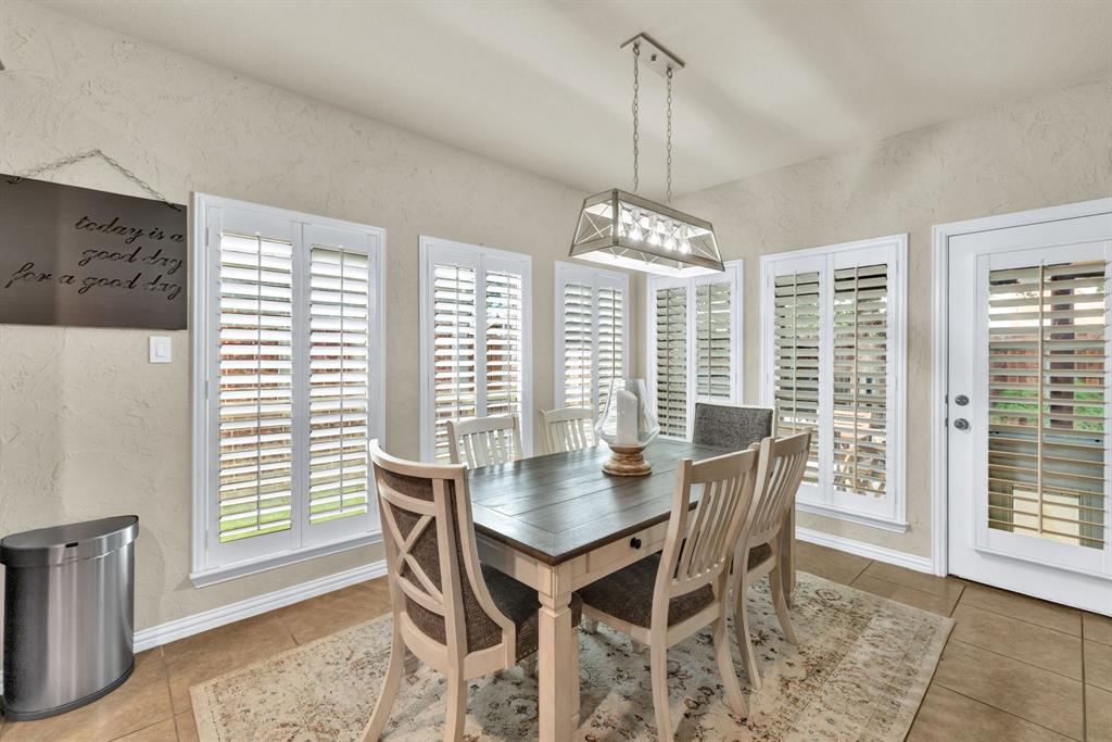 1701 Meadow Ranch Road McKinney, TX 75071 - Photo 12 of 40 a view of a dining room with furniture window and outside view