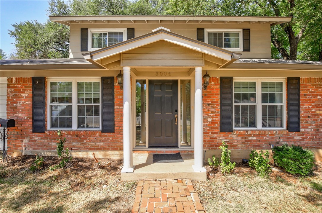3004 Stoneway Drive Austin, TX 78757 - Photo 1 of 1 a view of a brick house with large windows