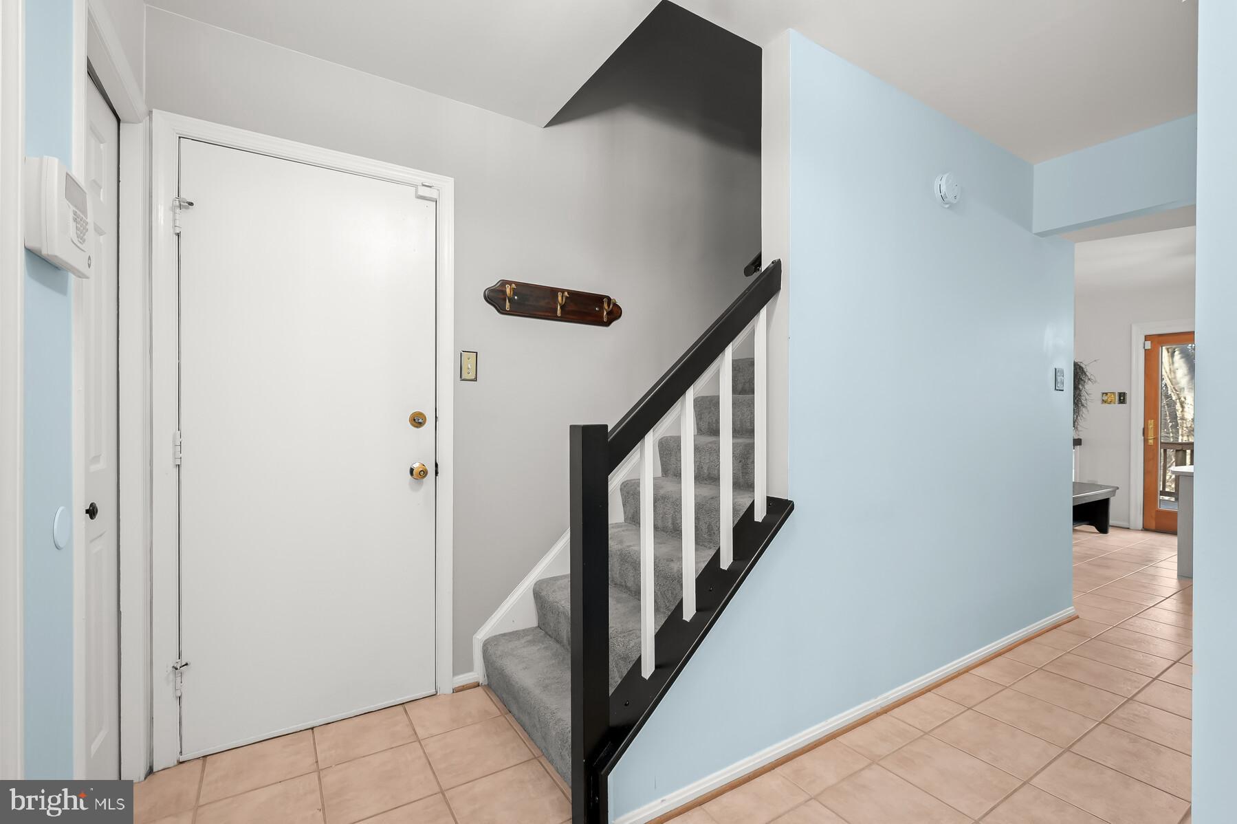 8522 Autumn Rust Road Ellicott City, MD 21043 - Photo 14 of 39 Garage access and stairs leading to upper level
