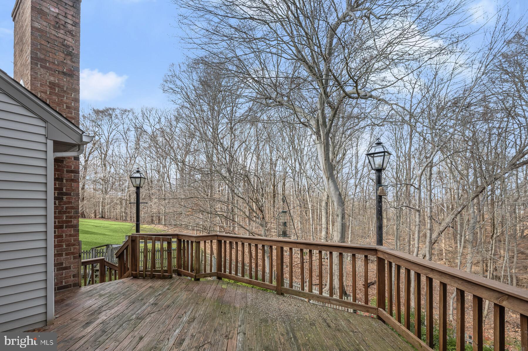 8522 Autumn Rust Road Ellicott City, MD 21043 - Photo 31 of 39 Rear deck with stairs leading to backyard