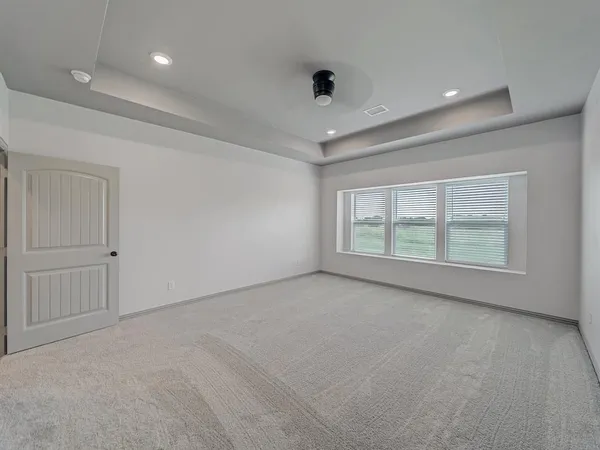 an empty room with a empty space and windows
