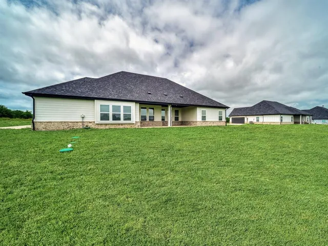 a house view with a garden space