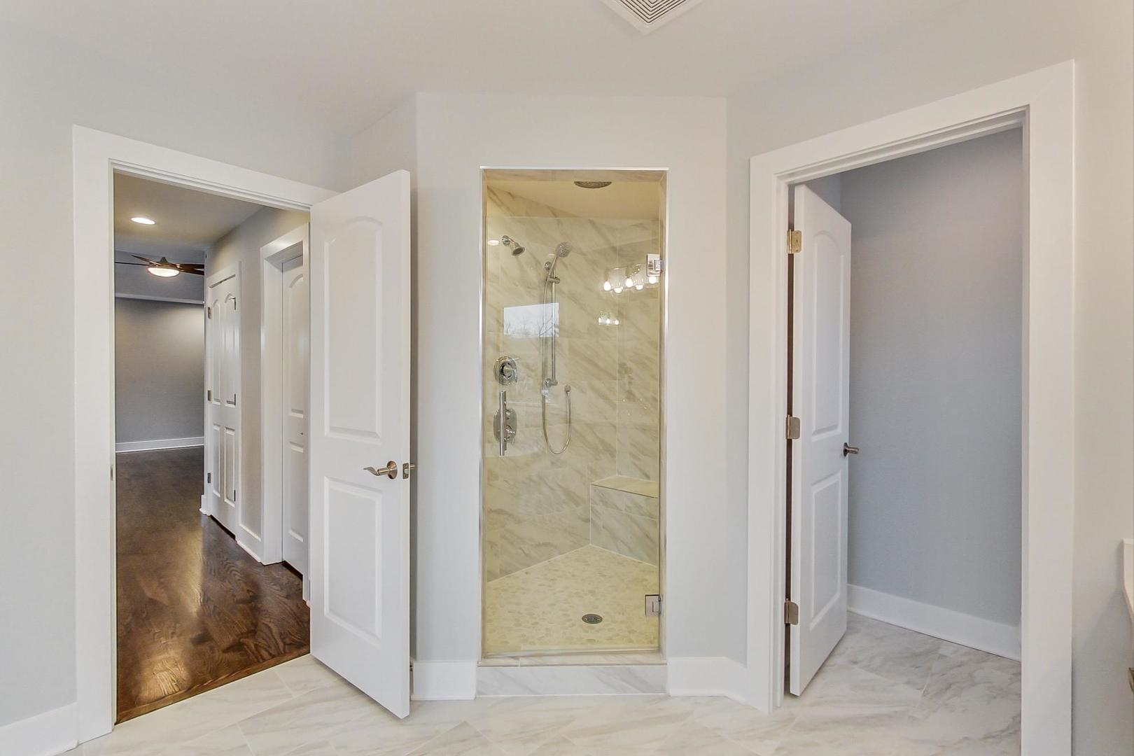 150 Avon Road Elmhurst, IL 60126 - Photo 11 of 18 a view of a bathroom that has a glass shower door