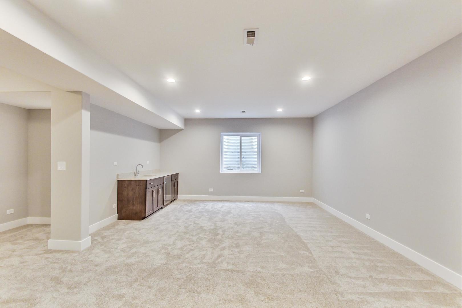 150 Avon Road Elmhurst, IL 60126 - Photo 14 of 18 an empty room with windows and cabinet