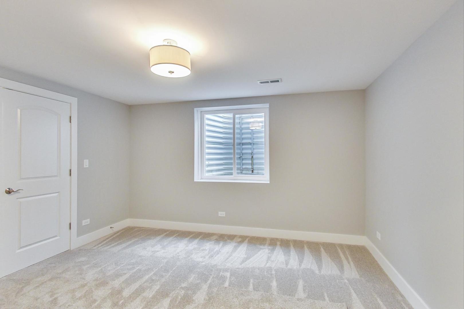 150 Avon Road Elmhurst, IL 60126 - Photo 18 of 18 an empty room with a window
