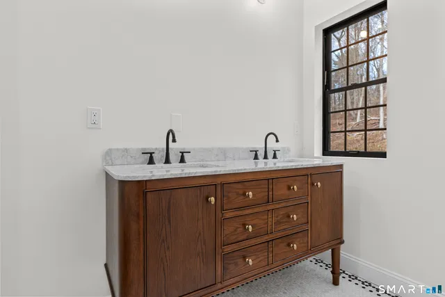 a bathroom with a sink and a mirror