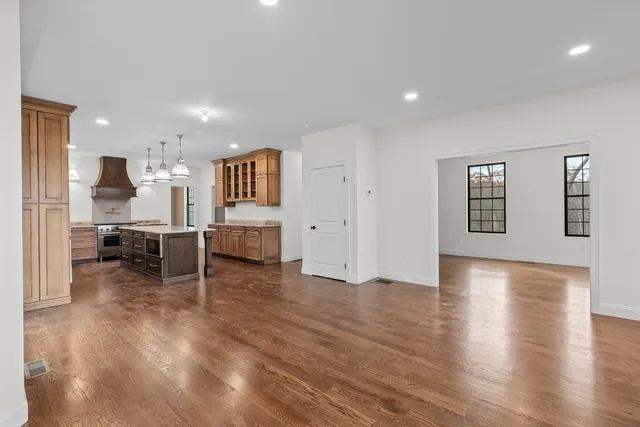 a bathroom with a sink shower and a mirror