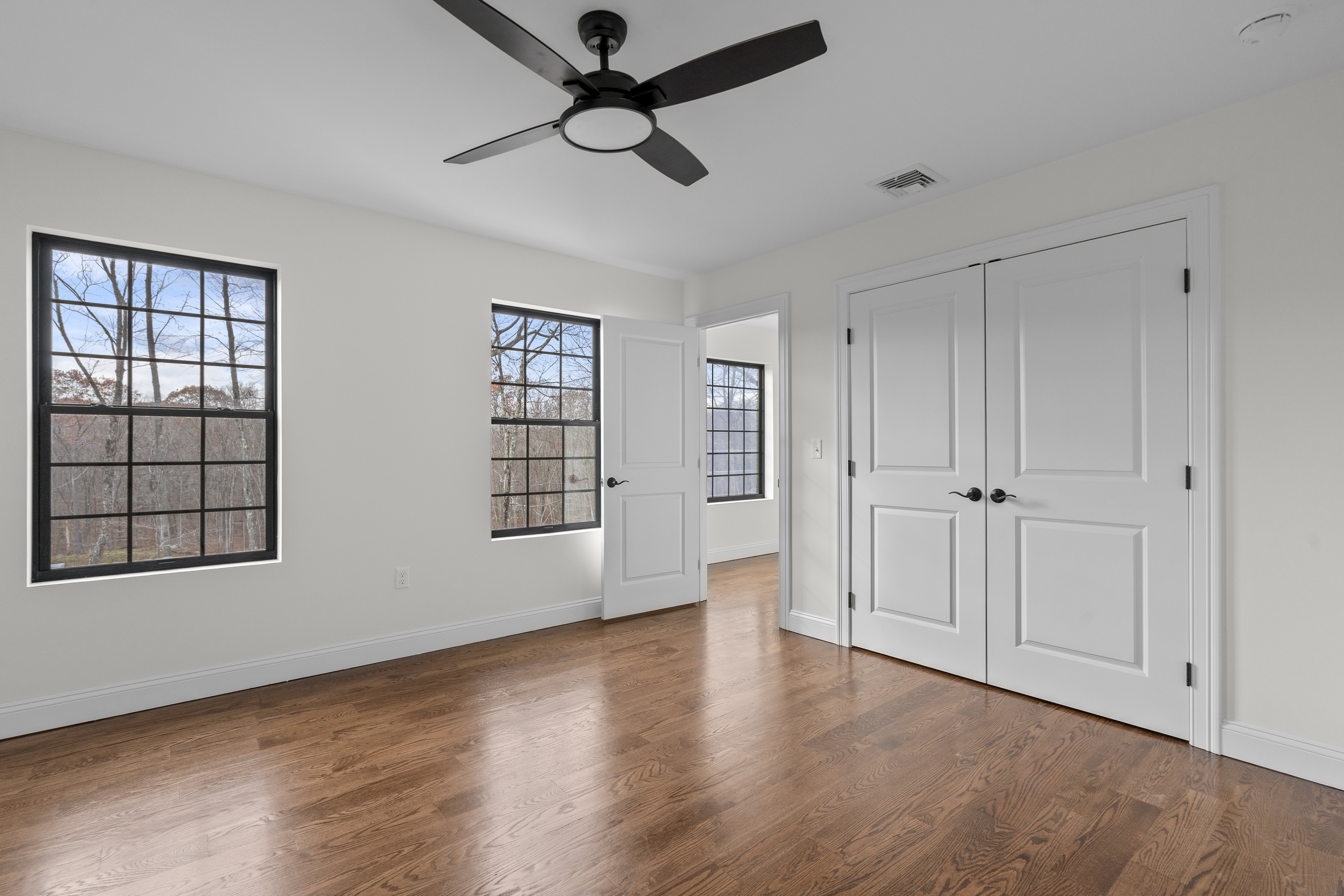 14 Lakewood Road East Hampton, CT 06424 - Photo 21 of 29 a view of an empty room with a window and wooden floor