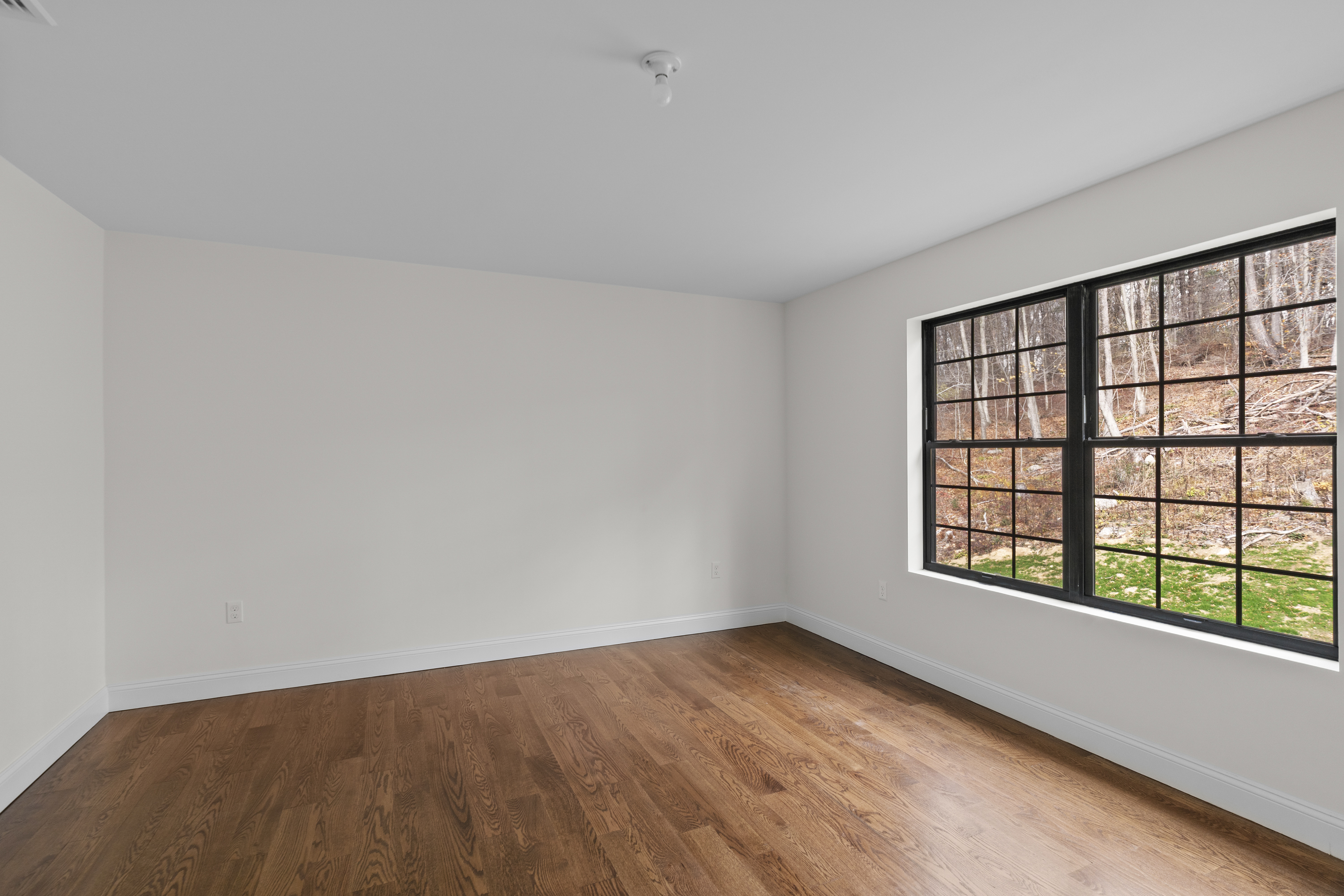 14 Lakewood Road East Hampton, CT 06424 - Photo 24 of 29 wooden floor in an empty room with a window