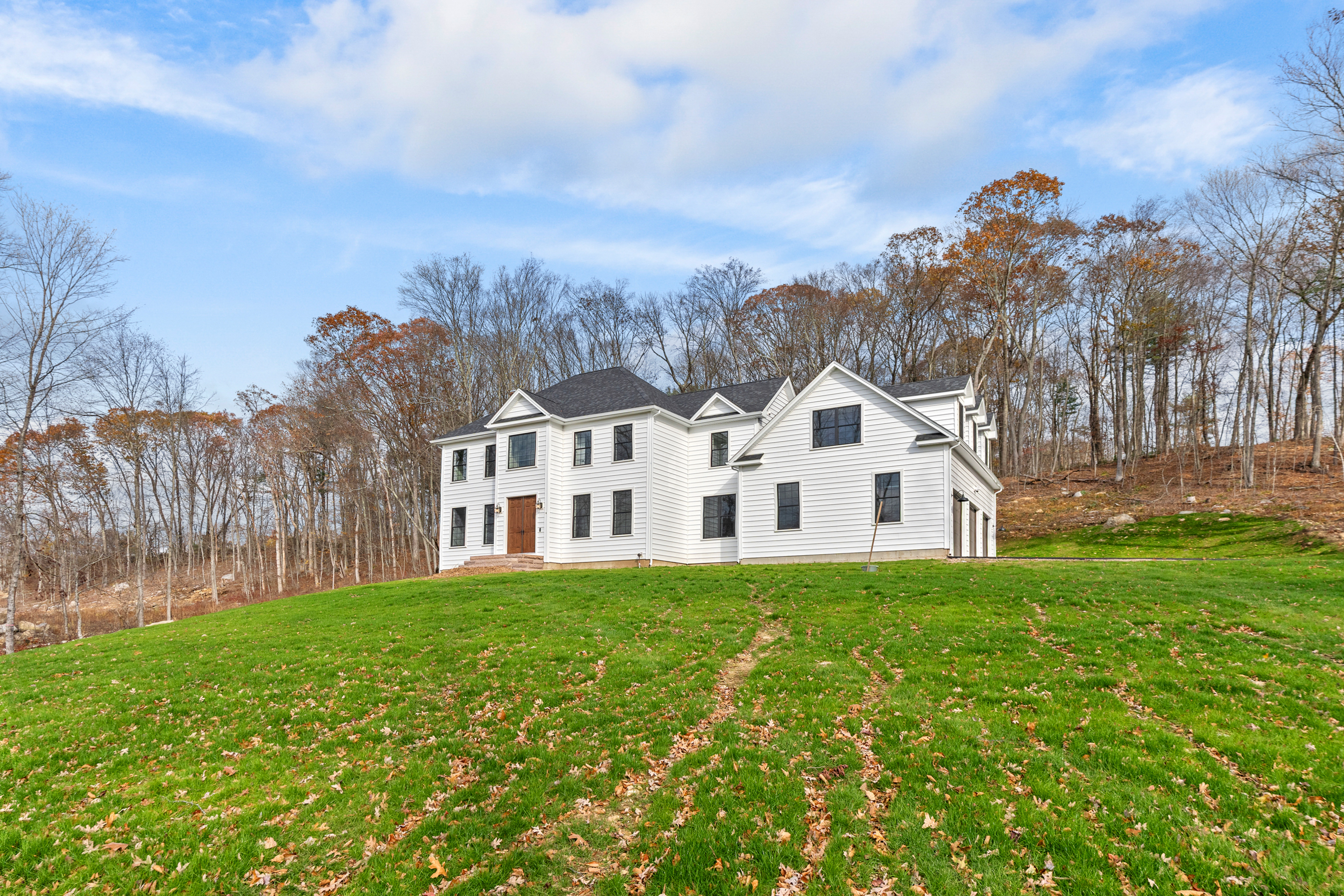 14 Lakewood Road East Hampton, CT 06424 - Photo 26 of 29 a front view of a house with a garden and trees