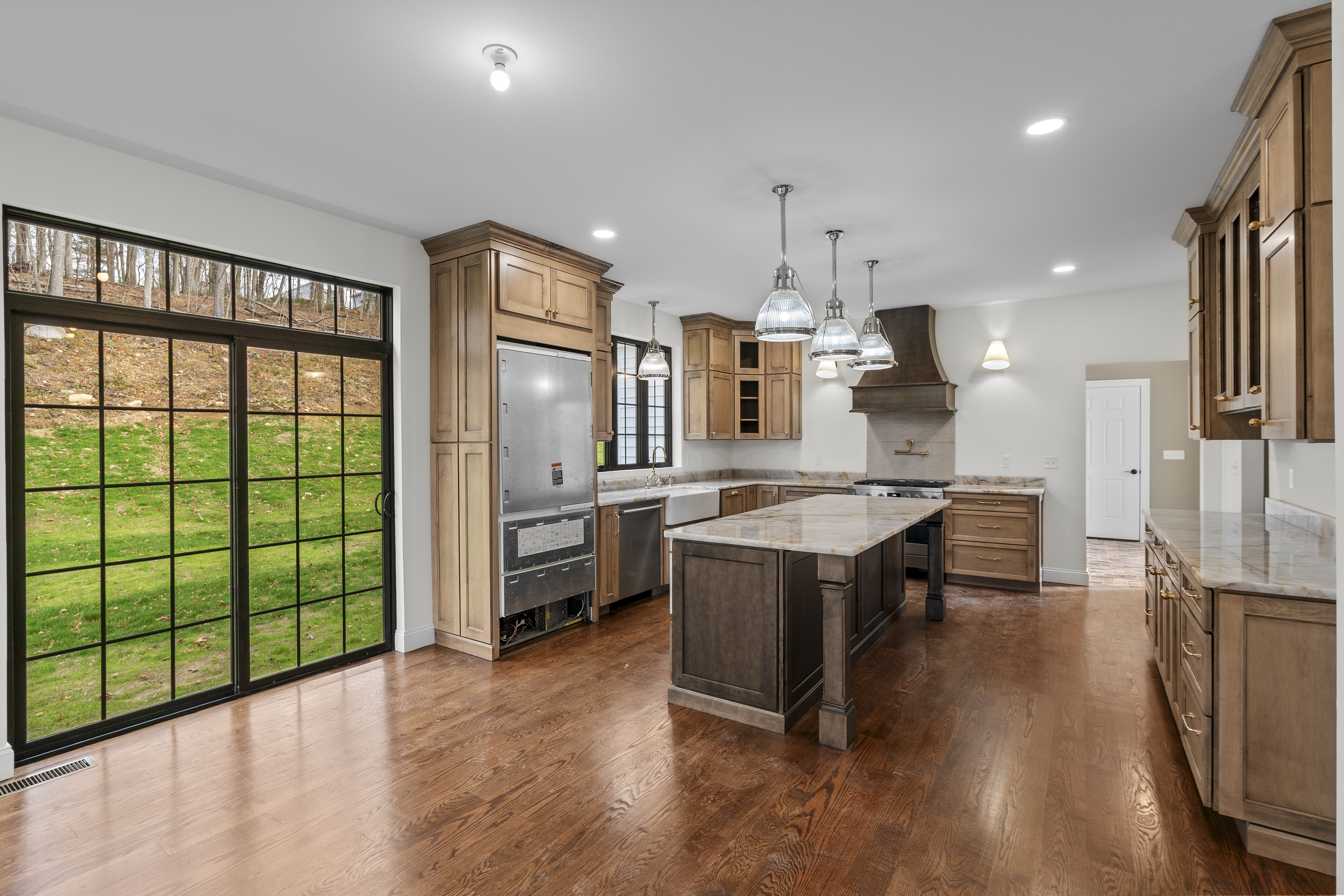 14 Lakewood Road East Hampton, CT 06424 - Photo 7 of 29 a large kitchen with a large window and stainless steel appliances