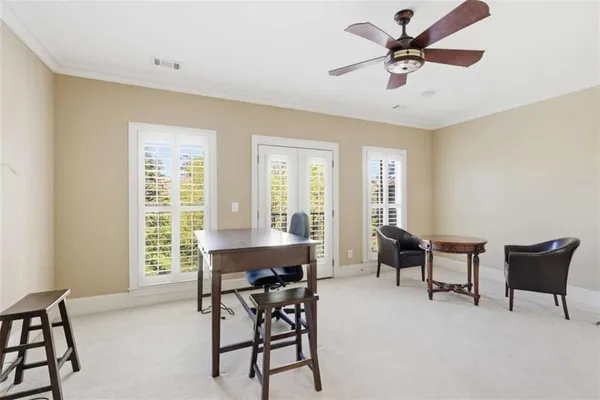 a view of a livingroom with furniture and a window