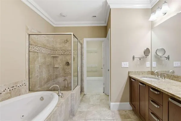 a bathroom with a bathtub and a shower