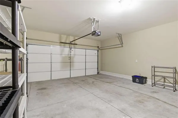 a backyard of a house with barbeque oven and wooden floor