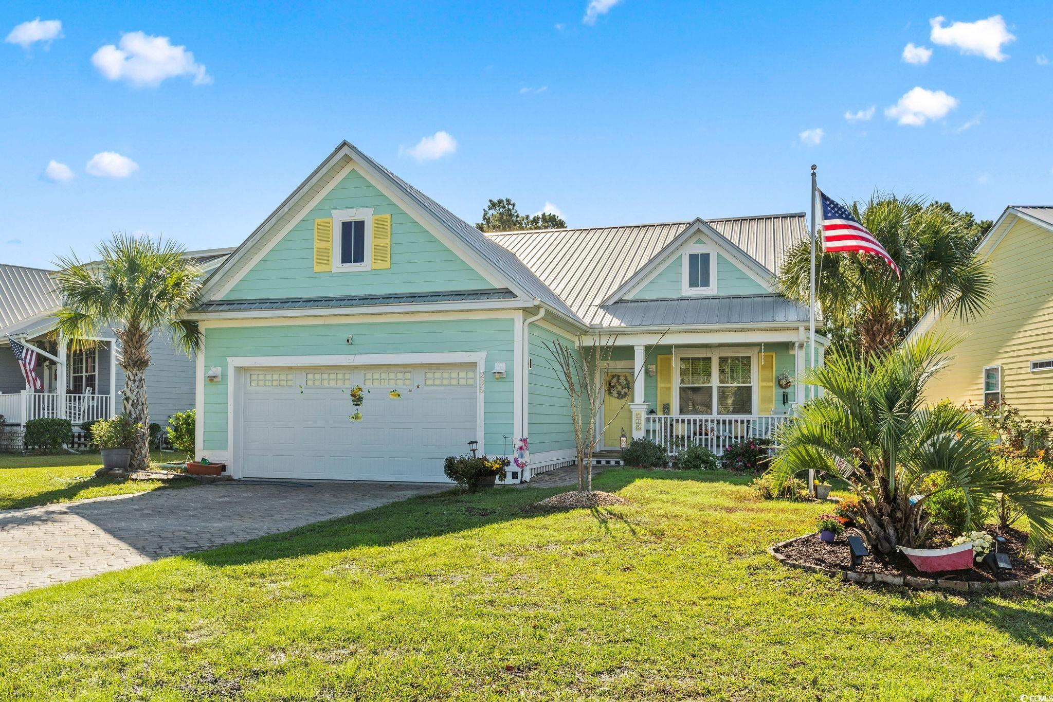 235 Waties Drive Murrells Inlet, SC 29576 - Photo 1 of 39 View of front facade featuring a front lawn, cover