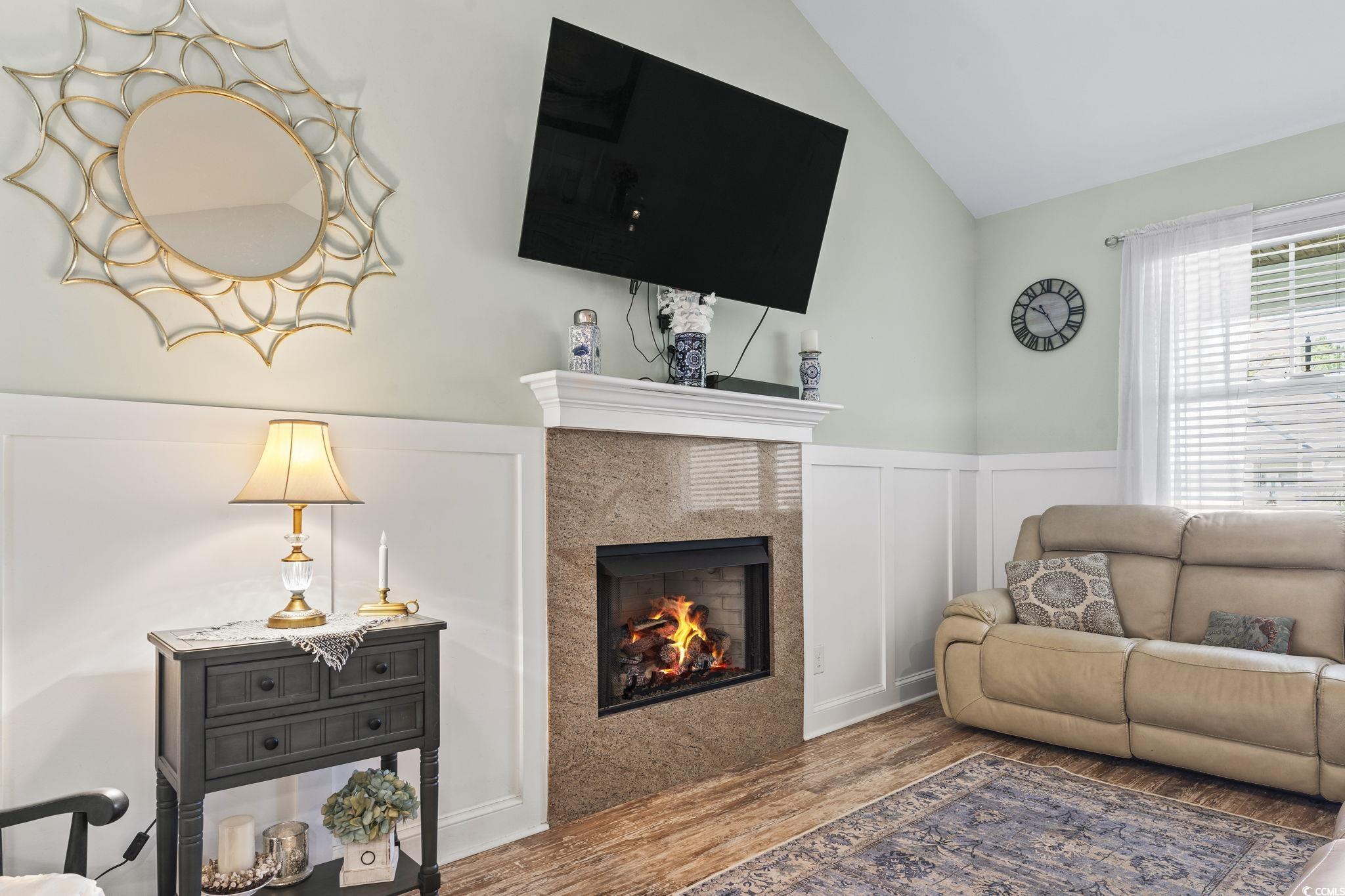 235 Waties Drive Murrells Inlet, SC 29576 - Photo 11 of 39 Living room with lofted ceiling, a premium firepla