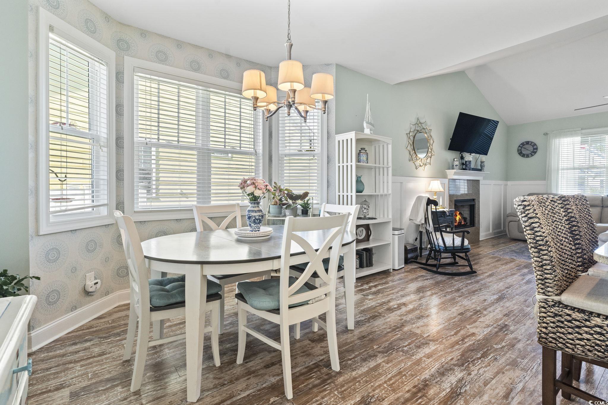 235 Waties Drive Murrells Inlet, SC 29576 - Photo 16 of 39 Dining space with lofted ceiling, a chandelier, an