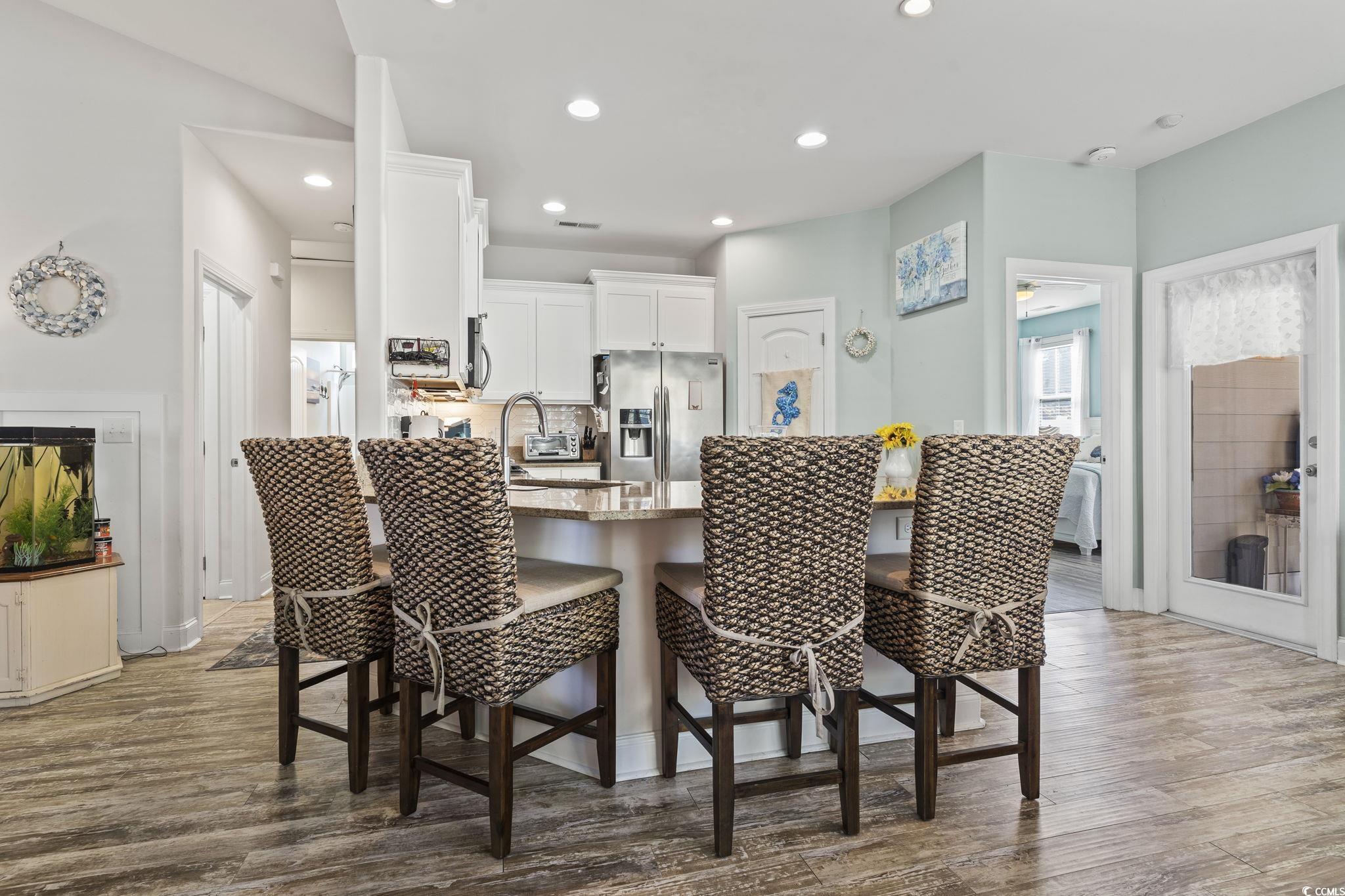 235 Waties Drive Murrells Inlet, SC 29576 - Photo 17 of 39 Dining space featuring hardwood / wood-style floor
