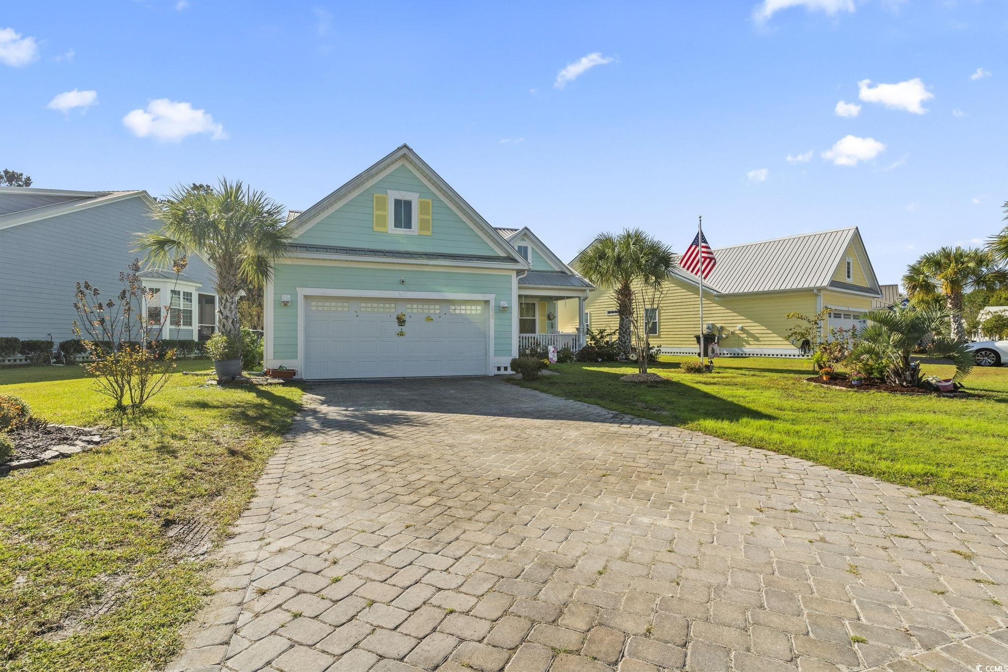 235 Waties Drive Murrells Inlet, SC 29576 - Photo 2 of 39 View of front of home featuring a garage and a fro