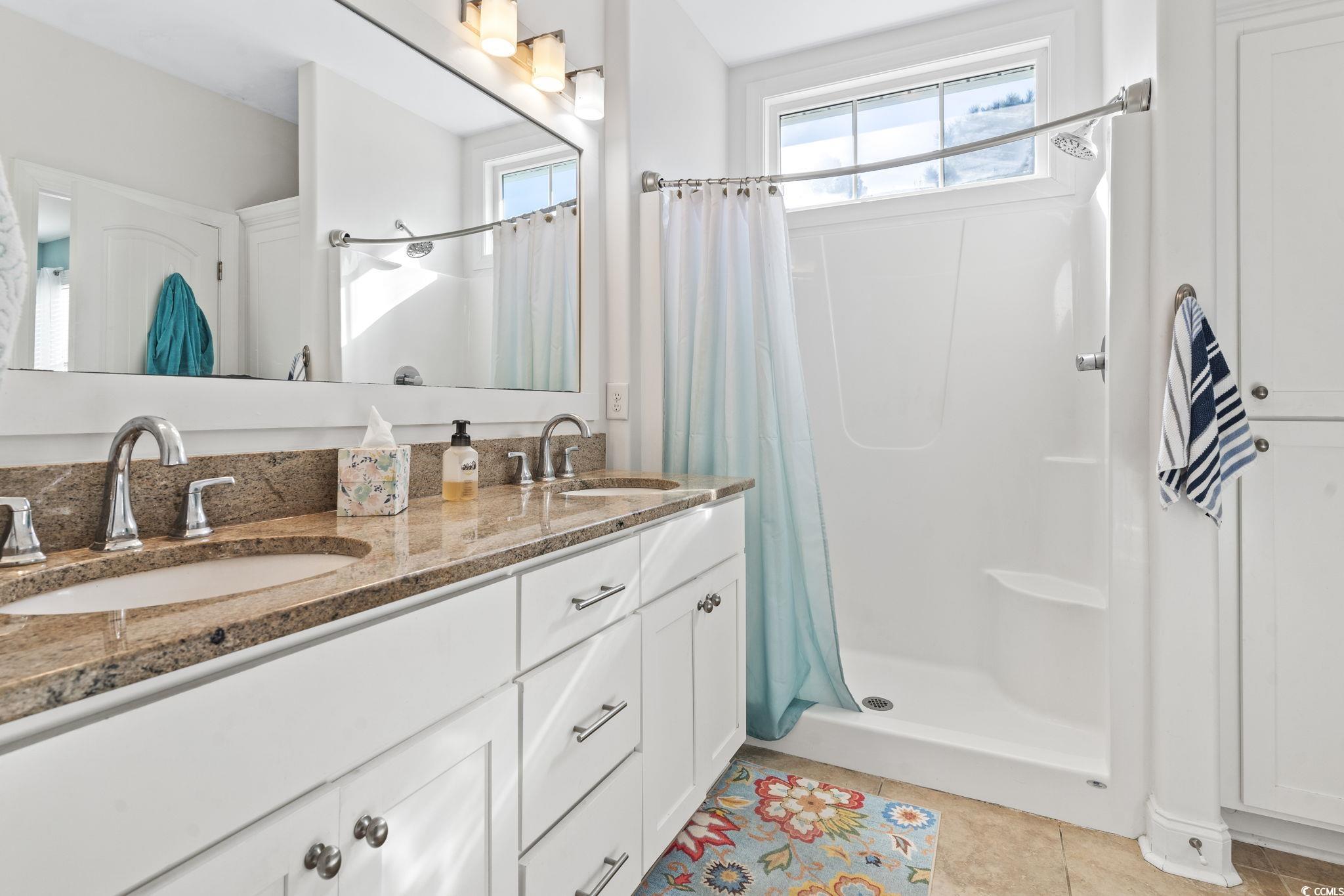 235 Waties Drive Murrells Inlet, SC 29576 - Photo 26 of 39 Bathroom with tile patterned floors, vanity, and a