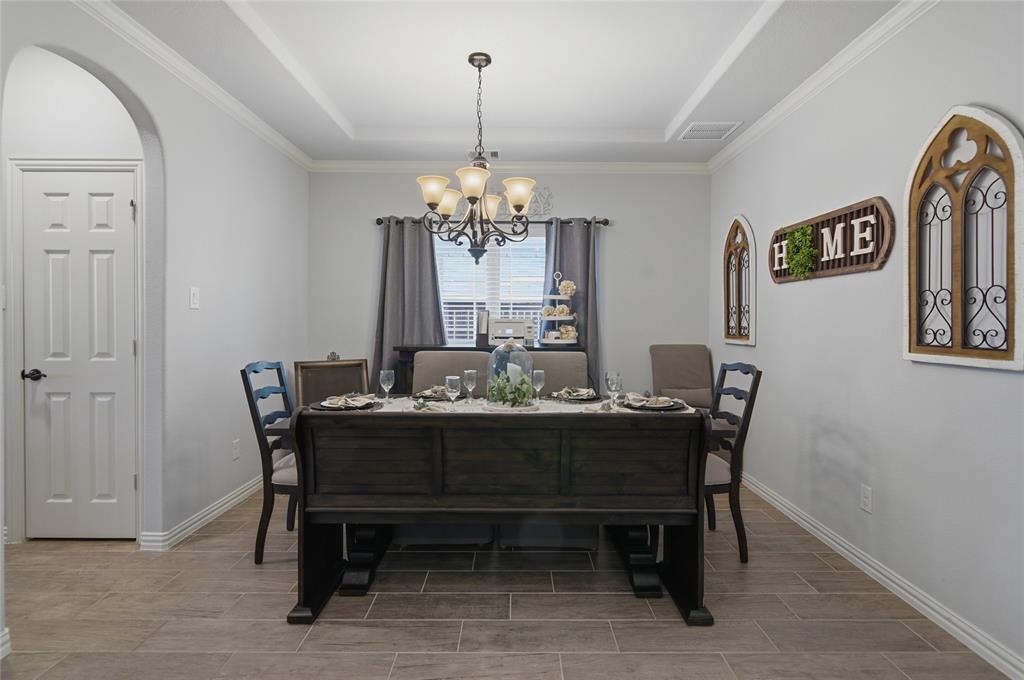 464 LeTara Ranch Drive Haslet, TX 76052 - Photo 16 of 37 Dining space featuring wood-finish tile flooring and light gray wall tones
