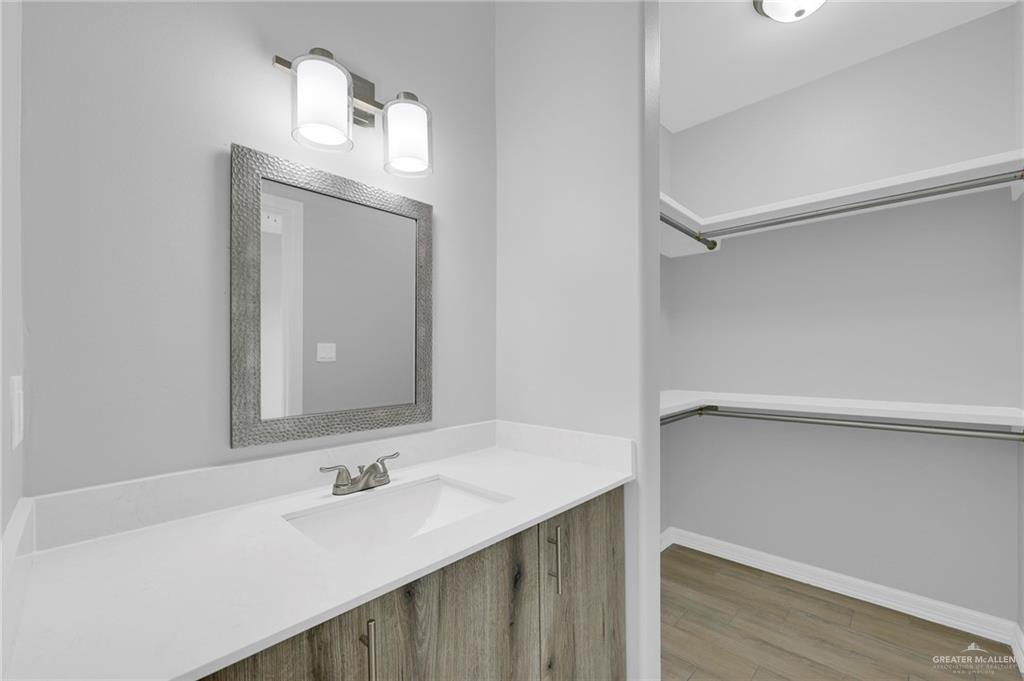 516 Bridget Street Weslaco, TX 78596 - Photo 17 of 24 a bathroom with a sink and a mirror