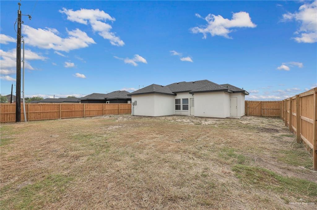 516 Bridget Street Weslaco, TX 78596 - Photo 19 of 24 a view of a house with a yard