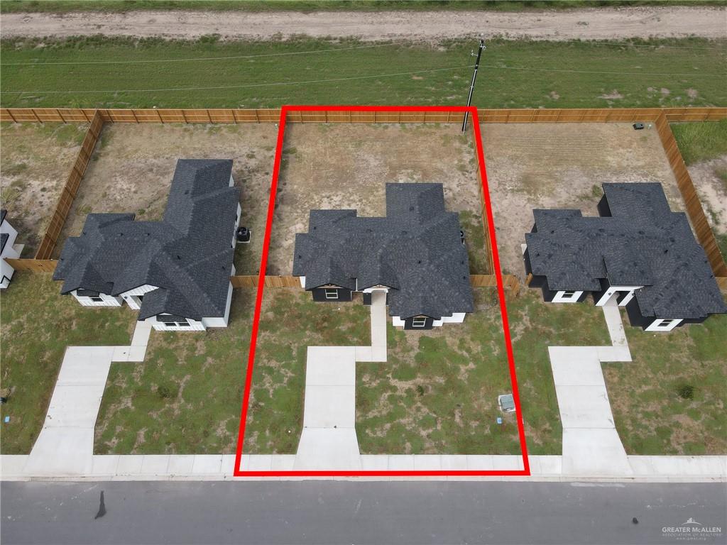 516 Bridget Street Weslaco, TX 78596 - Photo 21 of 24 an aerial view of a houses with a yard